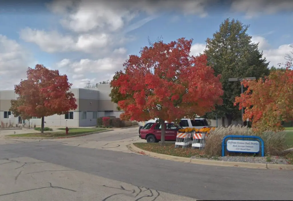 a street with trees and a building