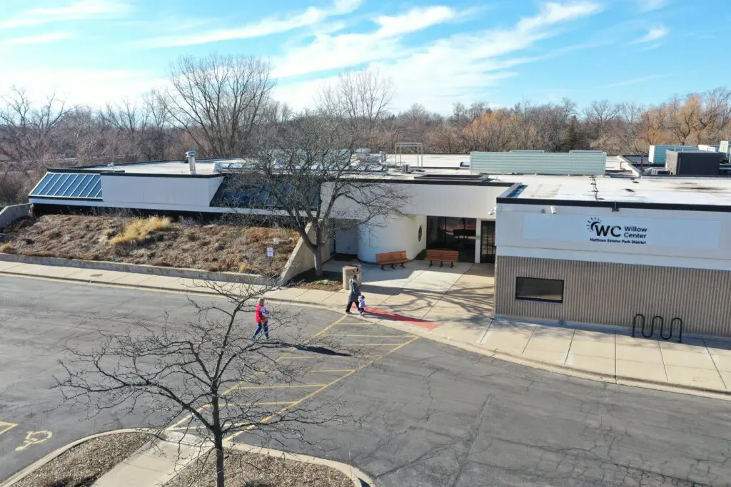 a building with people walking in front of it