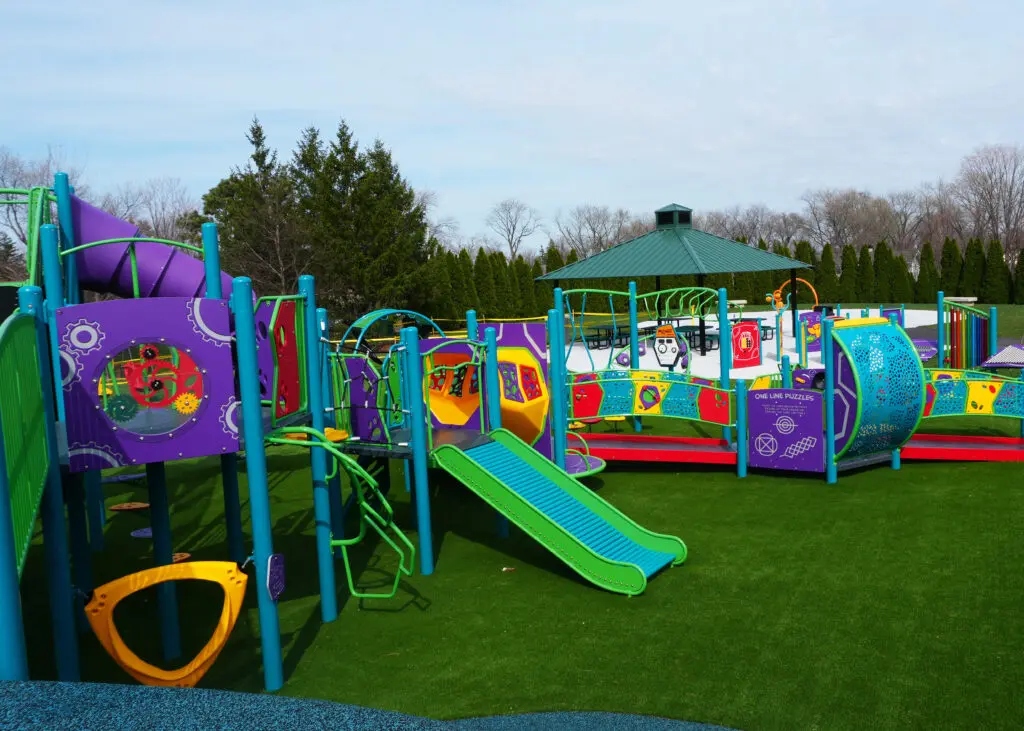 a playground with slides and a gazebo