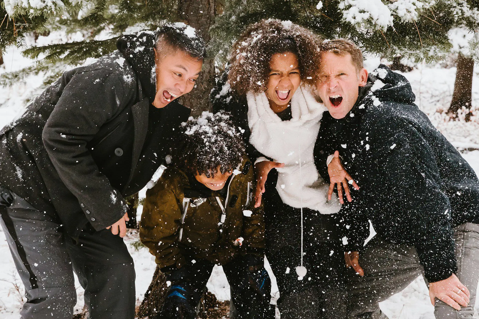 a group of people posing for a picture in the snow