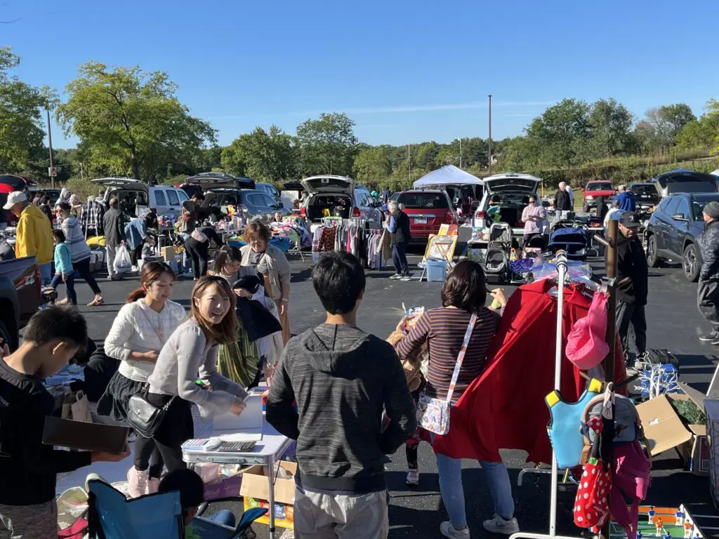 a group of people at a flea market