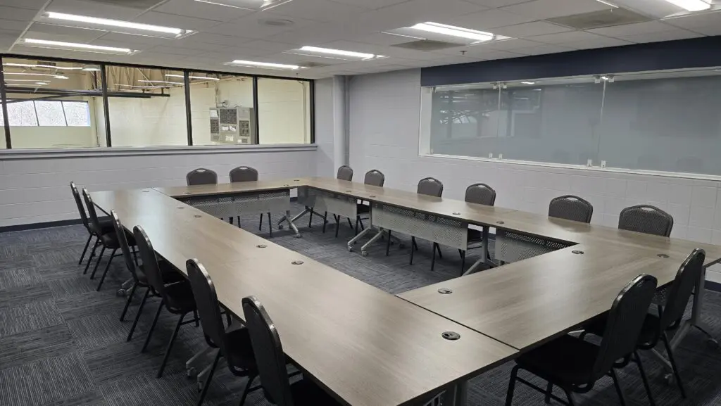 a room with a table and chairs