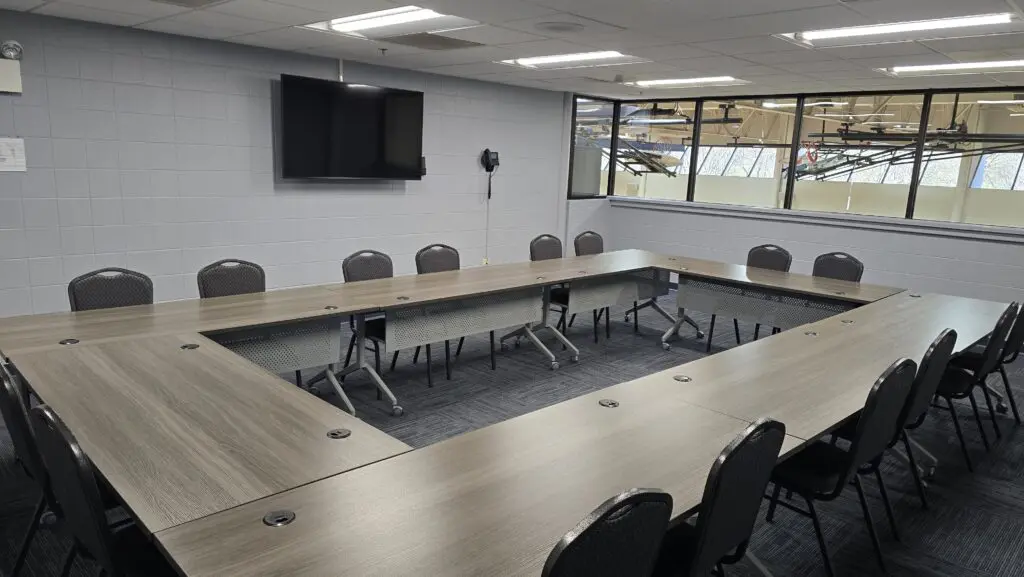 a room with a television and tables