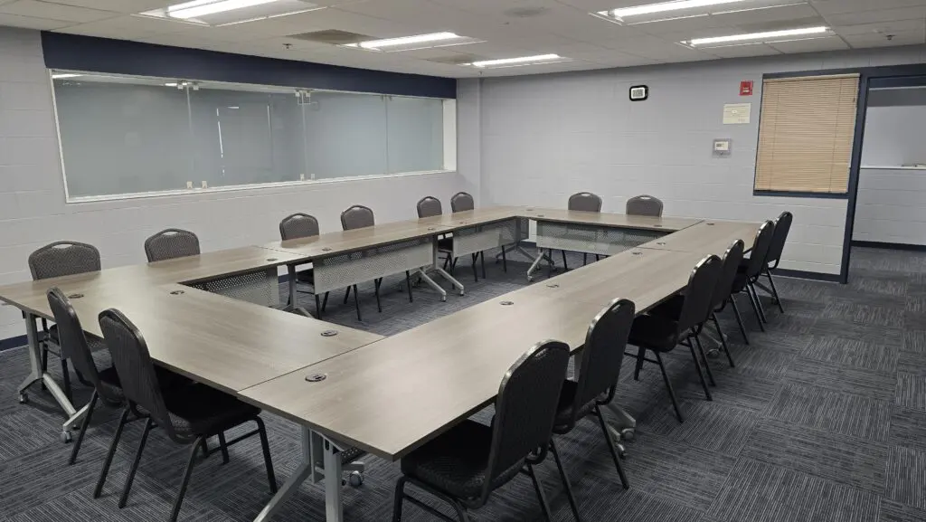 a room with a table and chairs