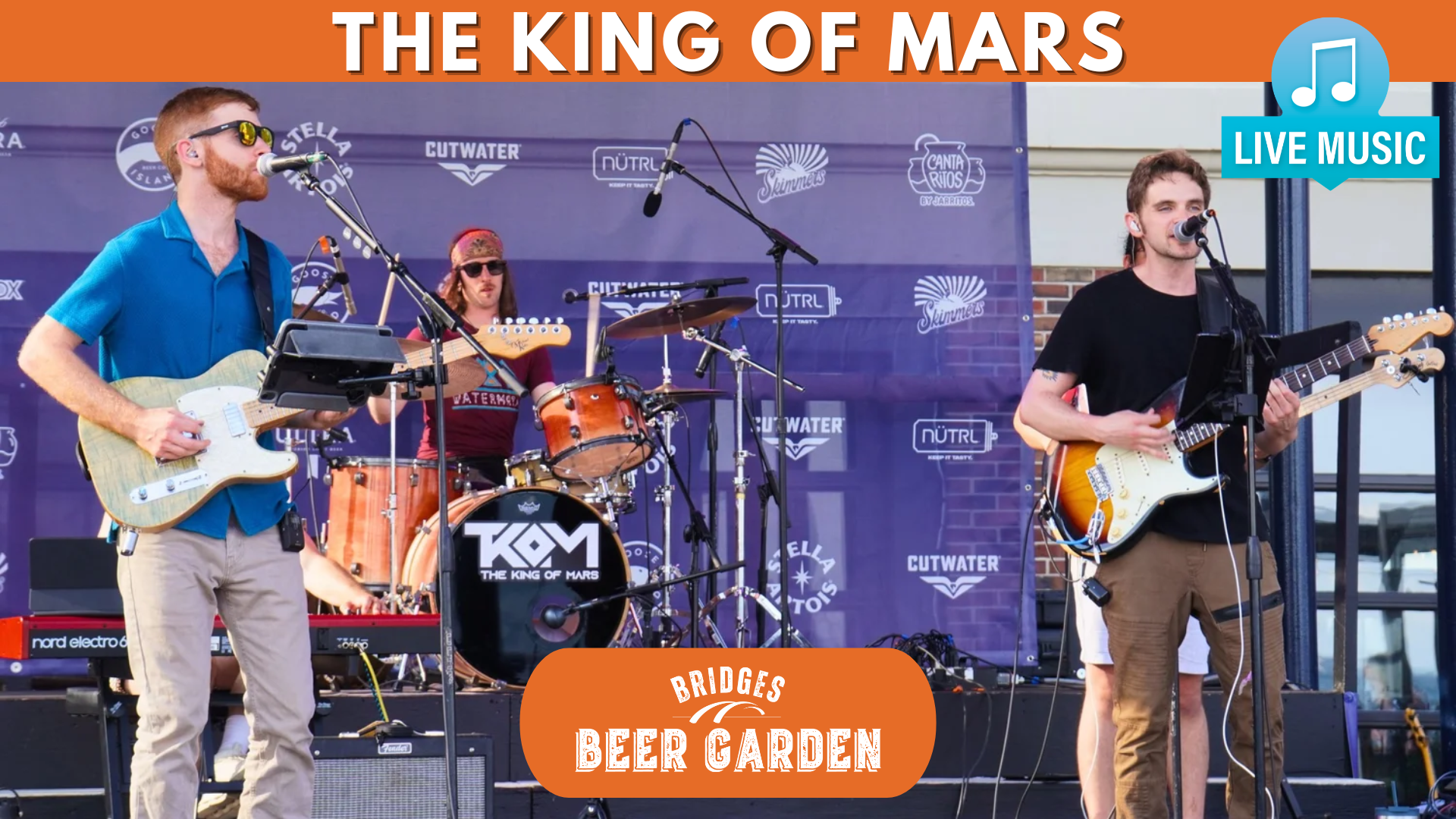 a group of people playing instruments on a stage