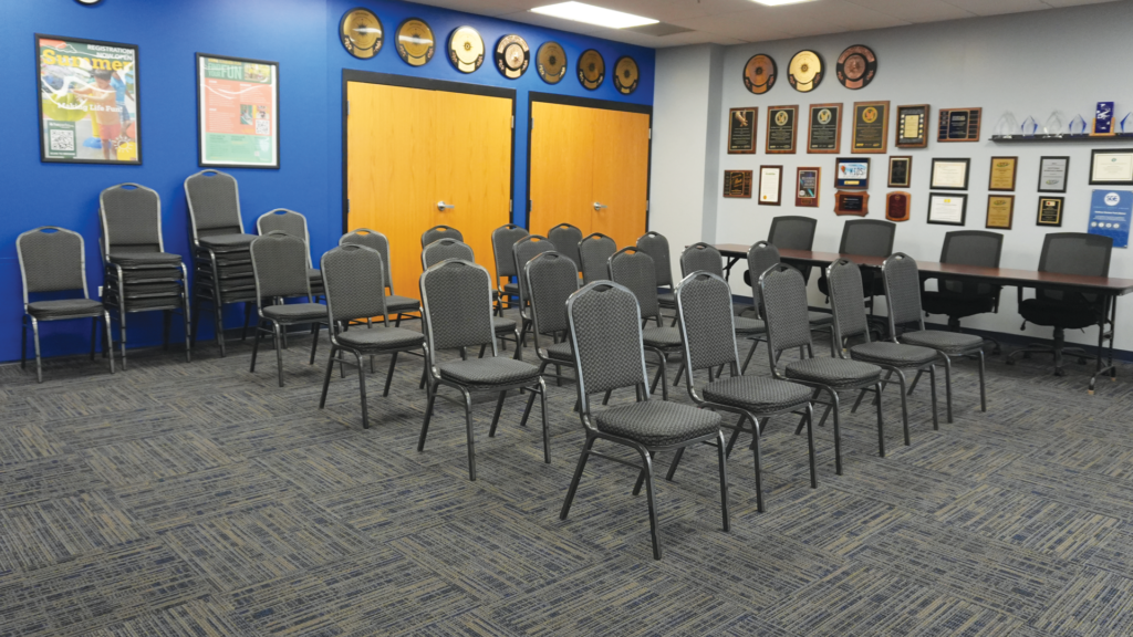 a room with chairs and tables