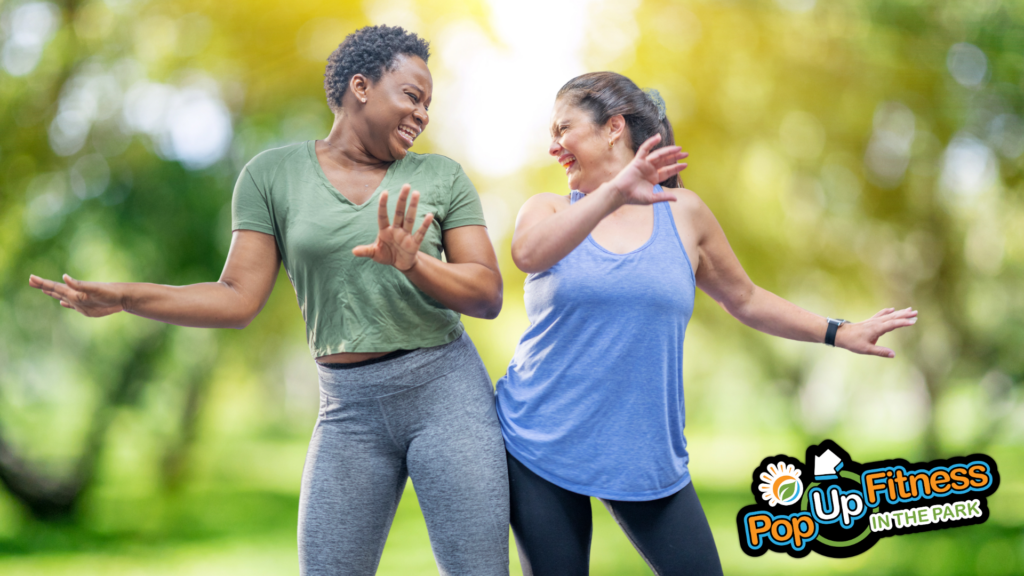 Two women taking a Zumba class in the park